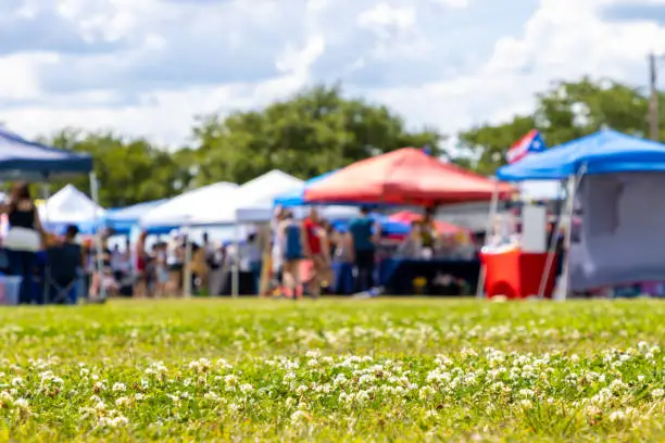 Rogersville MOfarmers market with tents and local vendors selling fresh produce and sourdough bread