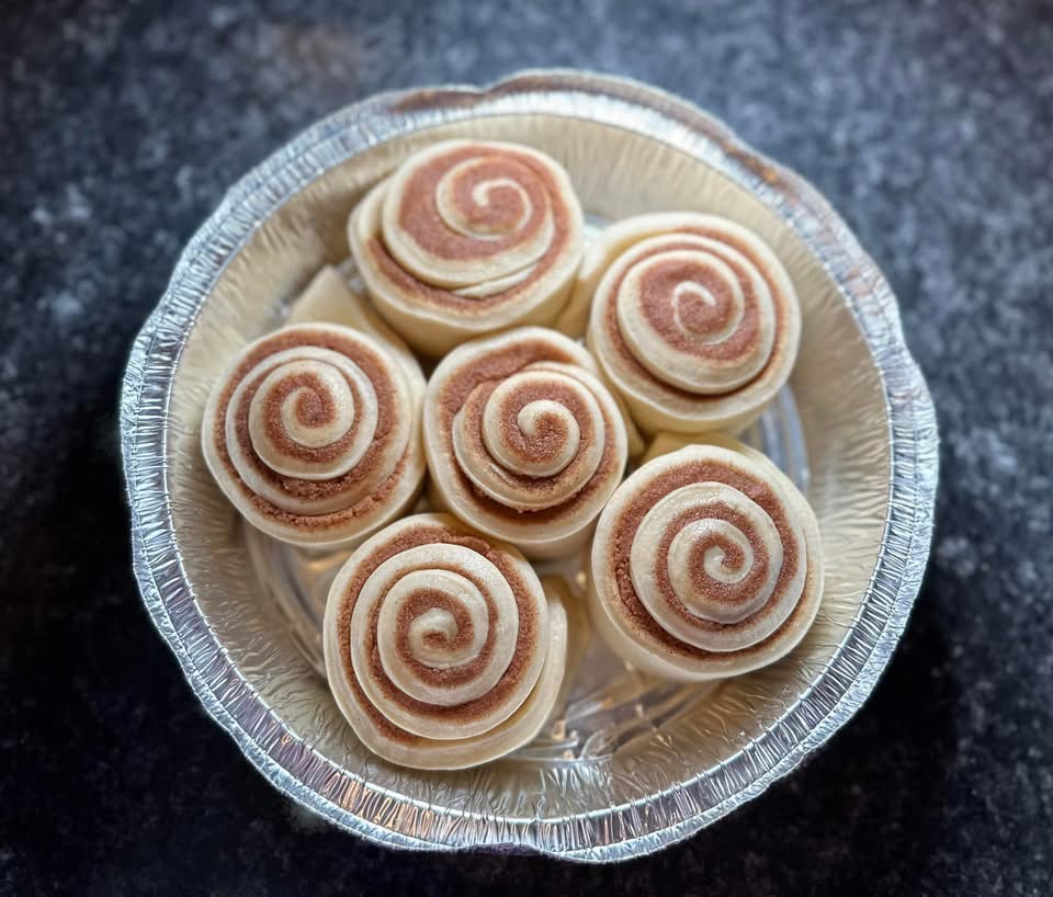 Unbaked cinnamon rolls prepared by Reign and Wilder