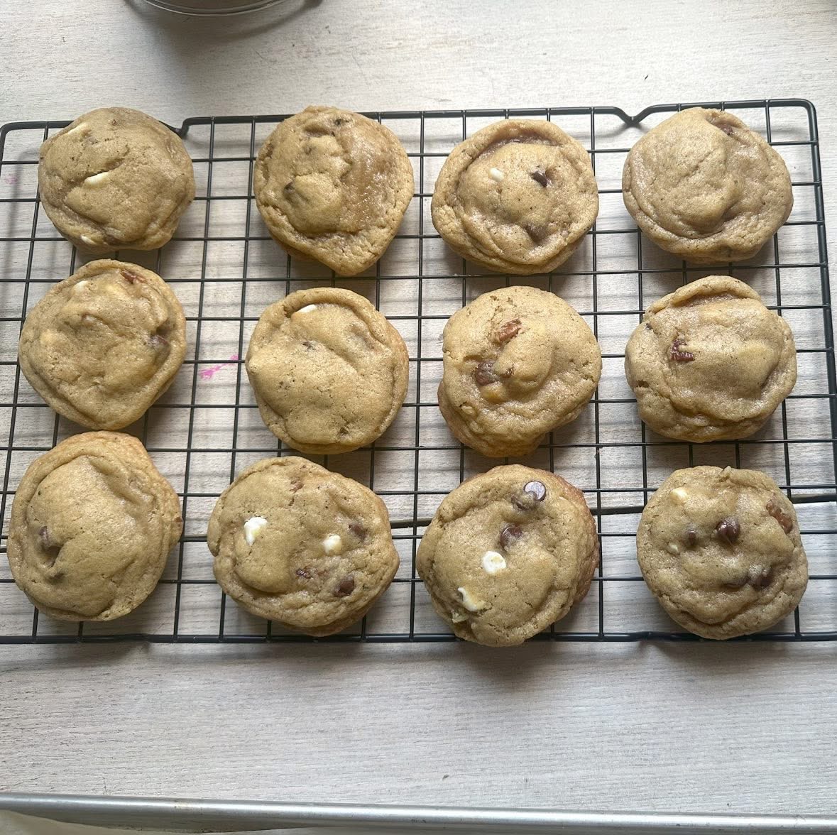 White chocolate pecan cookies cooling from Reign and Wilder
